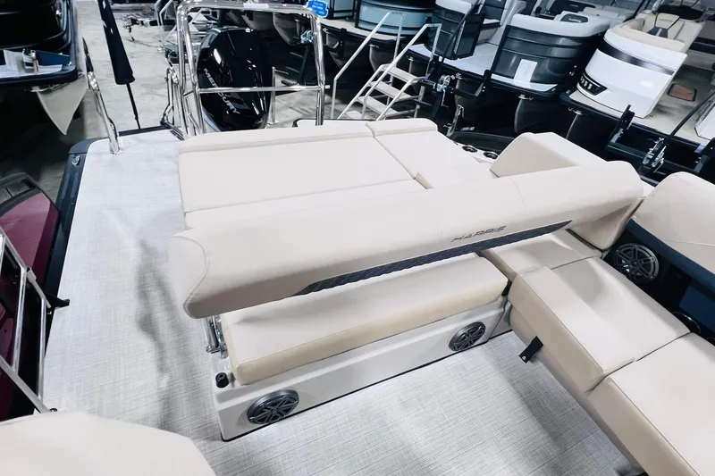 Slide: The Image of 2025 Harris Solstice 250 boat interior with beige seating and modern design. - 29