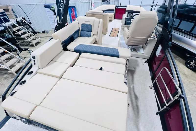 Slide: The Image of 2025 Harris Solstice 250 boat interior with luxurious seating and modern design. - 32