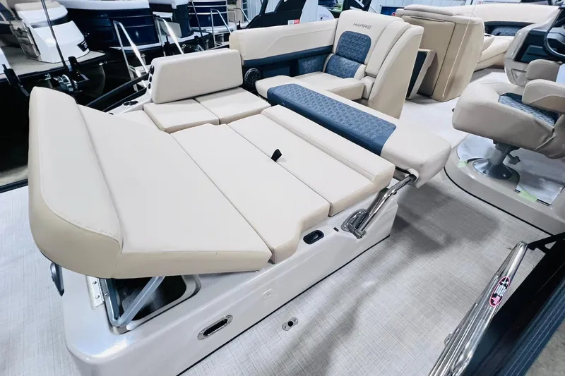 Slide: The Image of 2025 Harris Solstice 250 boat interior with luxurious beige seating and adjustable lounge. - 35