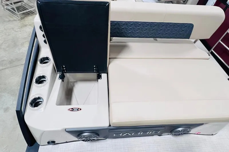 Slide: The Image of 2025 Harris Solstice 250 boat interior with cup holders and storage compartment. - 38