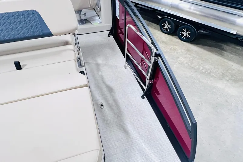 Slide: The Image of 2025 Harris Solstice 250 interior with beige seating and open side gate. - 43