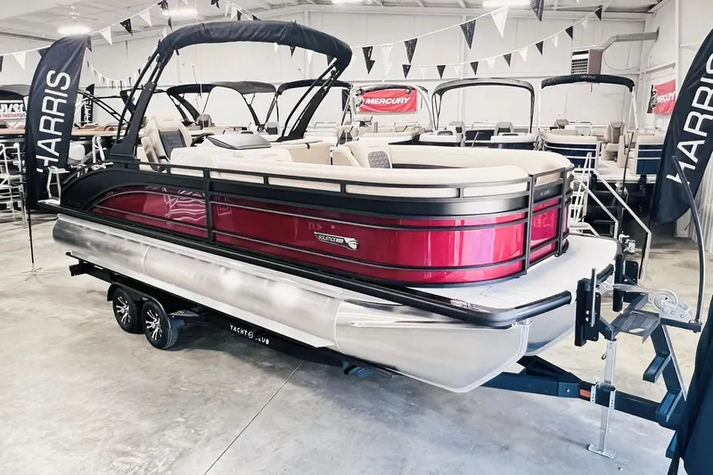 Slide: The Image of 2025 Harris Solstice 250 pontoon boat in showroom, featuring sleek design and vibrant red color. - 5