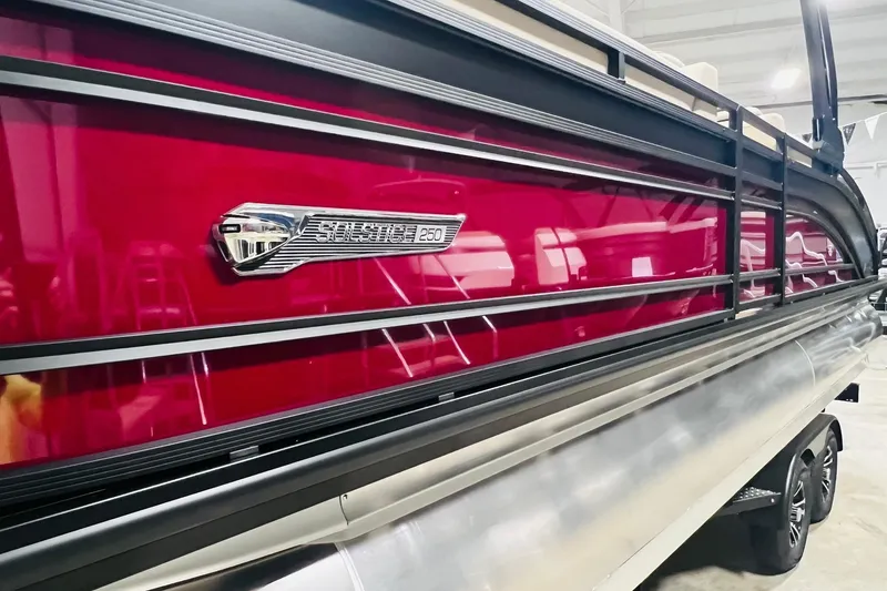 Slide: The Image of 2025 Harris Solstice 250 pontoon boat with sleek red exterior and modern design. - 52