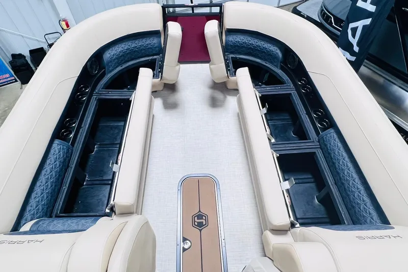 Slide: The Image of 2025 Harris Solstice 250 boat interior with luxurious seating and storage compartments. - 54