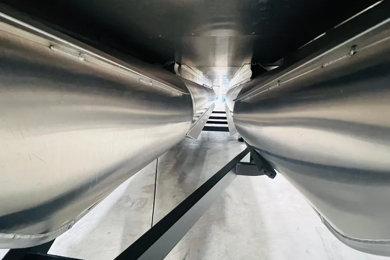 Slide: The Image of Underneath view of 2025 Harris Solstice 250 pontoon boat, showcasing sleek aluminum pontoons. - 62