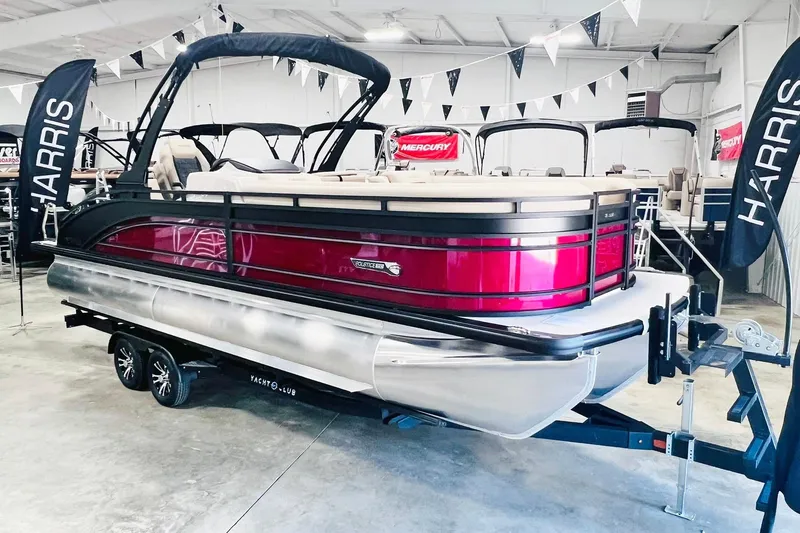 Slide: The Image of 2025 Harris Solstice 250 pontoon boat in showroom, featuring sleek design and vibrant red accents. - 7