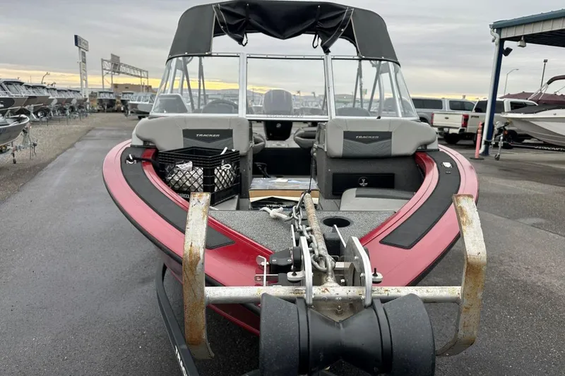 Slide: The Image of 2019 Tracker Targa V-19 Combo boat on trailer, parked in a marina lot. - 2