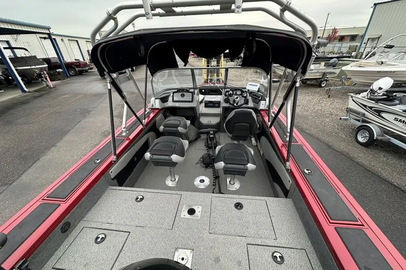 Slide: The Image of 2019 Tracker Targa V-19 Combo boat interior with seating and controls. - 3