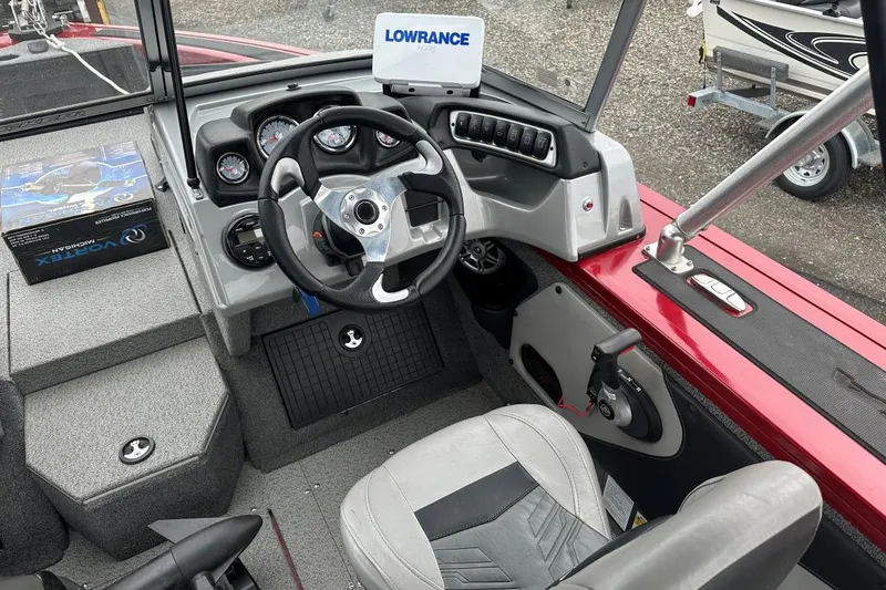 Slide: The Image of 2019 Tracker Targa V-19 Combo boat cockpit with steering wheel and Lowrance display. - 4