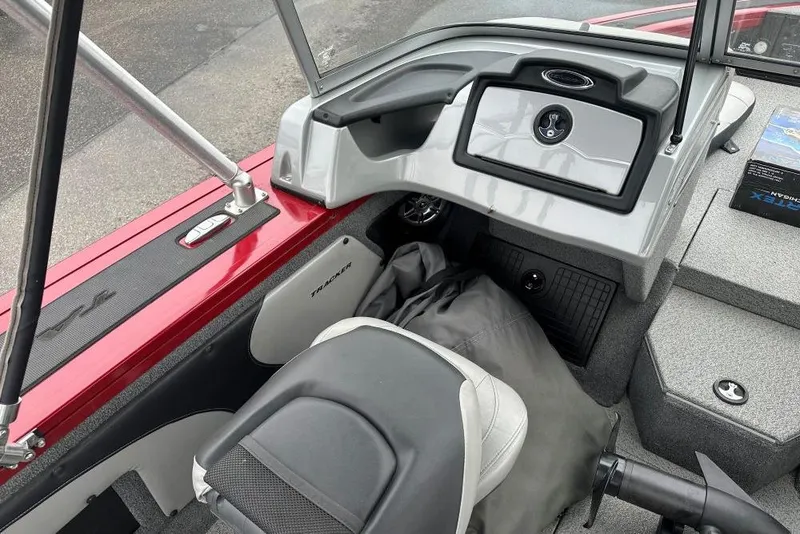 Slide: The Image of 2019 Tracker Targa V-19 Combo boat interior with steering console and seating. - 5