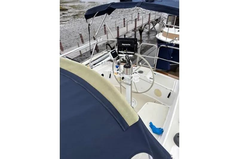 Slide: The Image of 1988 Tartan 31 Cutter Rigged Masthead Sloop cockpit with steering wheel and navigation equipment. - 10