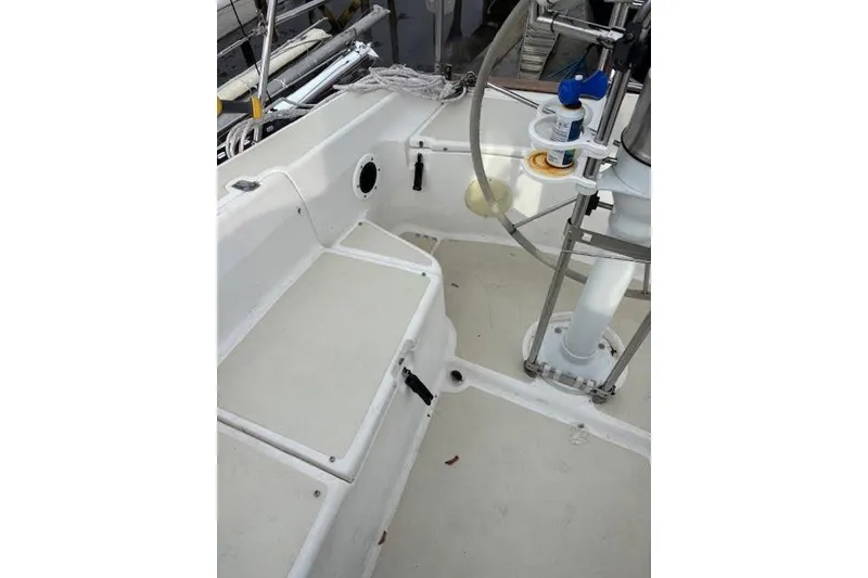 Slide: The Image of 1988 Tartan 31 Cutter Rigged Masthead Sloop cockpit with steering wheel and seating area. - 12