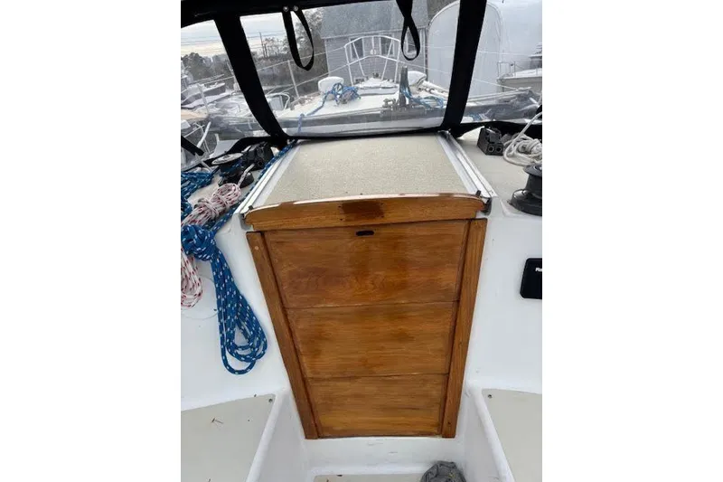 Slide: The Image of 1988 Tartan 31 Cutter Rigged Masthead Sloop cockpit with wooden hatch and ropes. - 15