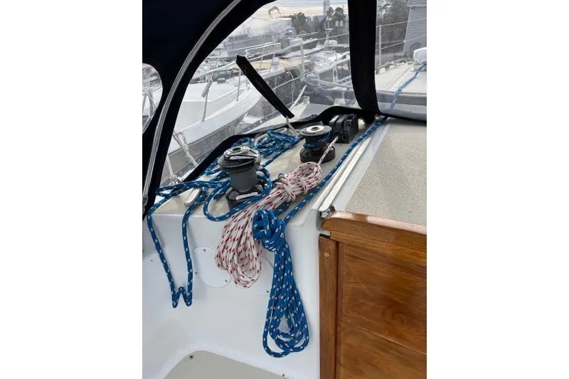 Slide: The Image of 1988 Tartan 31 Cutter Rigged Masthead Sloop deck with ropes and winches. - 16