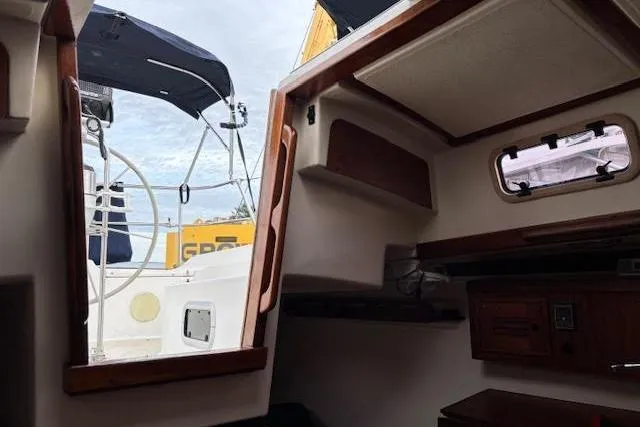 Slide: The Image of Interior view of 1988 Tartan 31 Cutter Rigged Masthead Sloop, showing cabin and cockpit. - 22