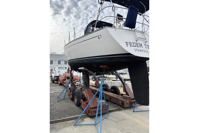 Slide: The Image of 1988 Tartan 31 Cutter Rigged Masthead Sloop on stands, Stamford location. - 3