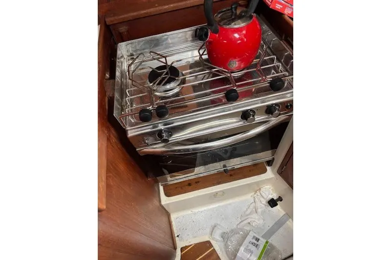 Slide: The Image of Red kettle on stove inside 1988 Tartan 31 Cutter Rigged Masthead Sloop. - 33