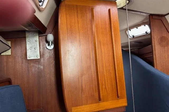 Slide: The Image of Interior of 1988 Tartan 31 Cutter Rigged Masthead Sloop with wooden cabinetry. - 47