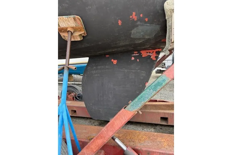 Slide: The Image of 1988 Tartan 31 Cutter Rigged Masthead Sloop keel on dry dock, showing wear and maintenance. - 5