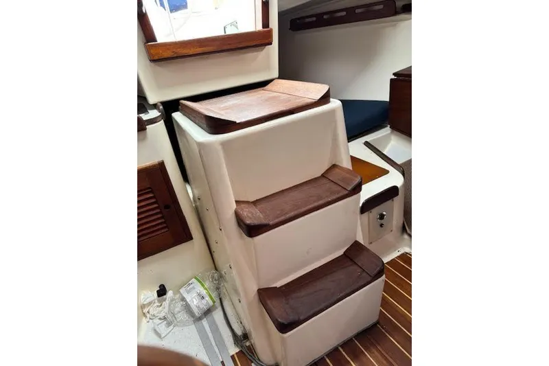 Slide: The Image of Interior steps of 1988 Tartan 31 Cutter Rigged Masthead Sloop with wooden accents. - 54