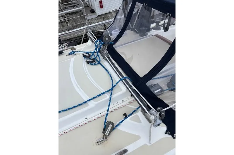 Slide: The Image of 1988 Tartan 31 Cutter Rigged Masthead Sloop deck with blue rigging and canopy. - 9