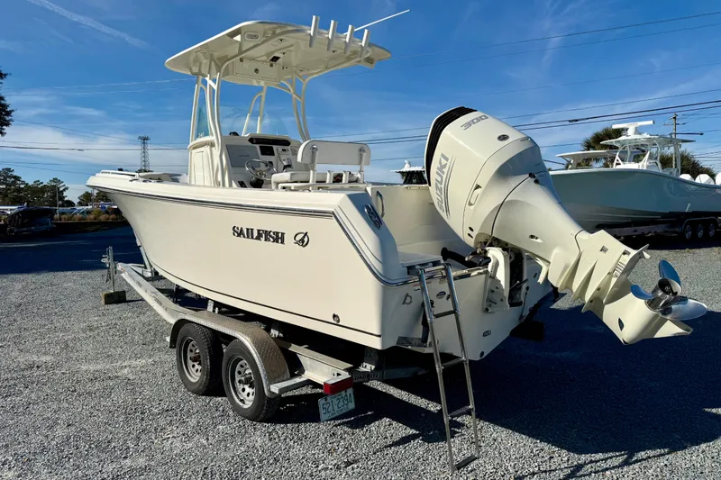 Slide: The Image of 2016 Sailfish 240 CC boat on trailer with Suzuki outboard motor. - 31