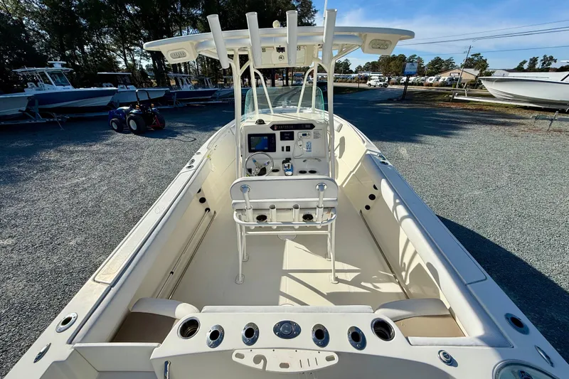 Slide: The Image of 2016 Sailfish 240 CC boat interior with helm, seating, and rod holders. - 43