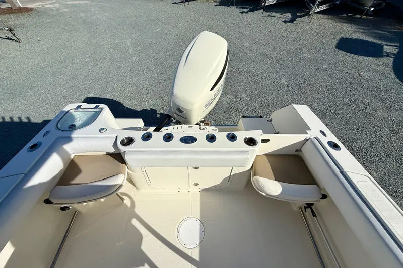 Slide: The Image of 2016 Sailfish 240 CC boat interior with seating and motor, viewed from above. - 45