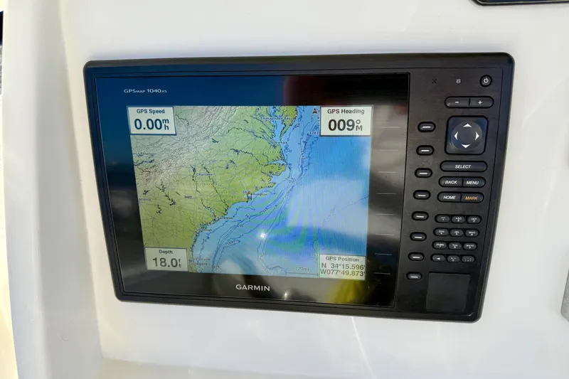 Slide: The Image of Garmin GPS display on 2016 Sailfish 240 CC boat, showing map and navigation data. - 52