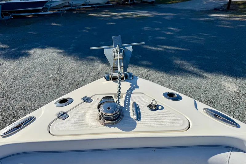 Slide: The Image of Bow of 2016 Sailfish 240 CC boat with anchor and chain mechanism. - 56