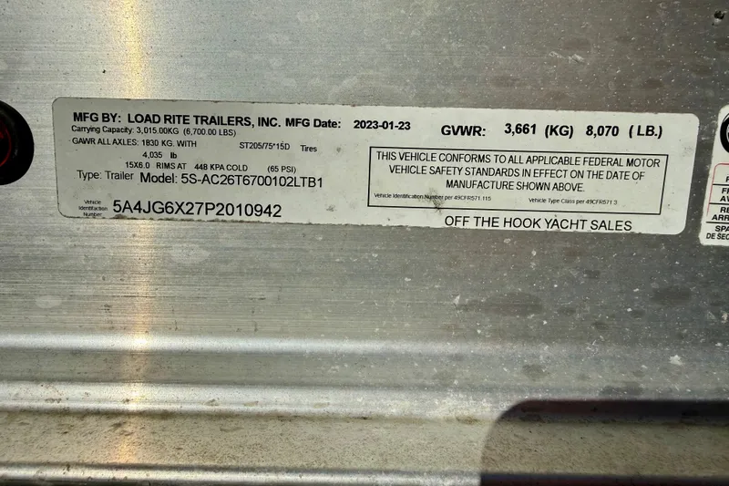 Slide: The Image of Label on Load Rite trailer, manufactured in 2023, showing specifications and compliance details. - 60