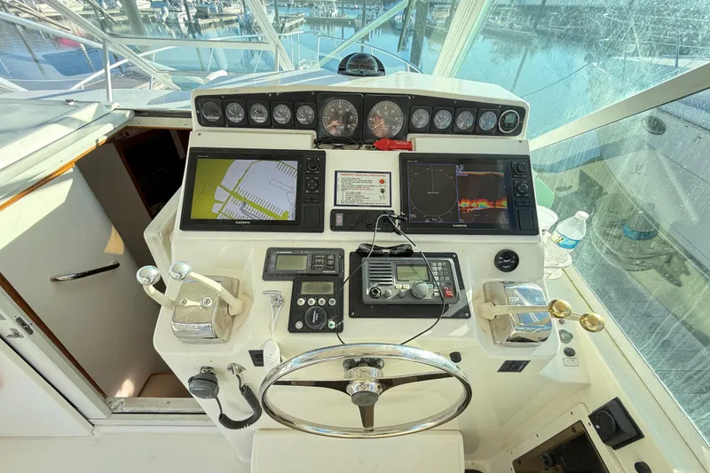 Slide: The Image of Helm of a 1996 Cabo 35 yacht with navigation systems. - 12