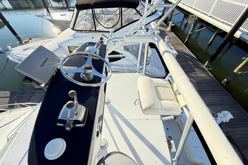 Slide: The Image of 1996 Cabo 35 boat dashboard with marine radio and wiring. - 24