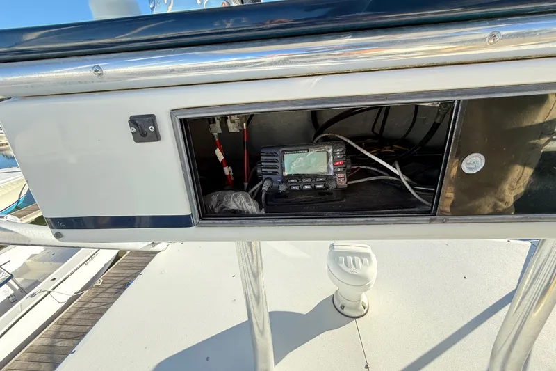 Slide: The Image of 1996 Cabo 35 boat at dock with helm station. - 25
