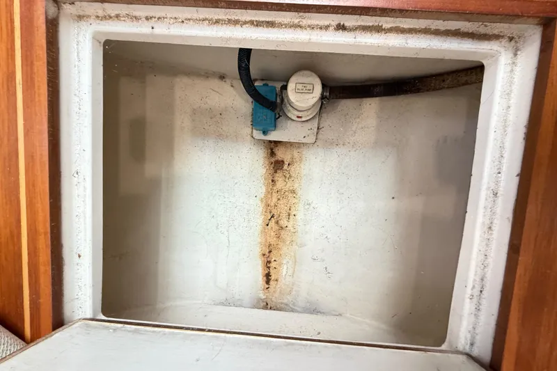 Slide: The Image of Interior of a 1996 Cabo 35 boat with storage compartments. - 47