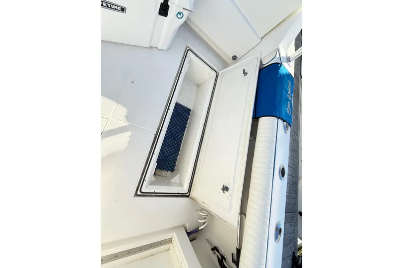 Slide: The Image of Open engine compartment on a 1996 Cabo 35 boat. - 49