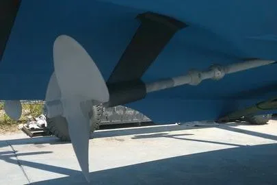 Slide: The Image of 1996 Cabo 35 boat hull with underwater vent detail. - 79