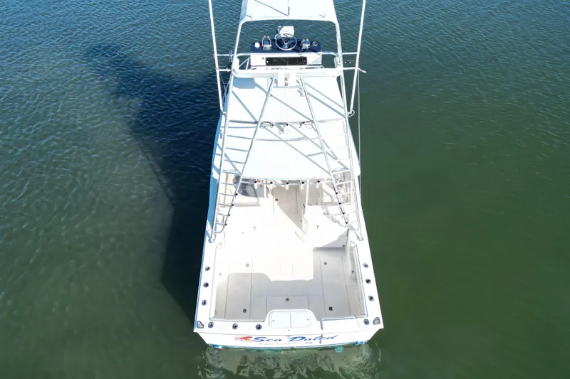 Slide: The Image of Aerial view of a 1996 Cabo 35 boat on calm water. - 8