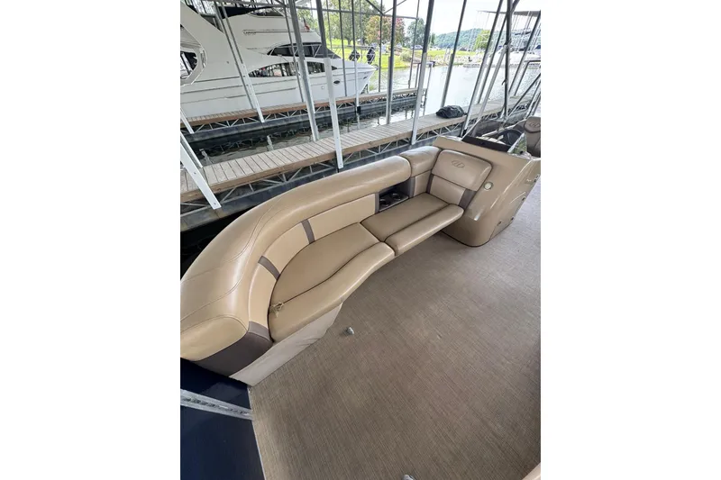 Slide: The Image of Luxurious seating on 2019 Harris CX 230 boat, docked at marina. - 3