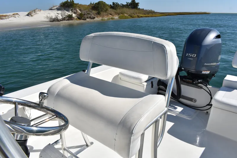 Slide: The Image of 2017 Bay Rider 2260 FS Skiff with Yamaha 150 engine, coastal waters in background. - 10