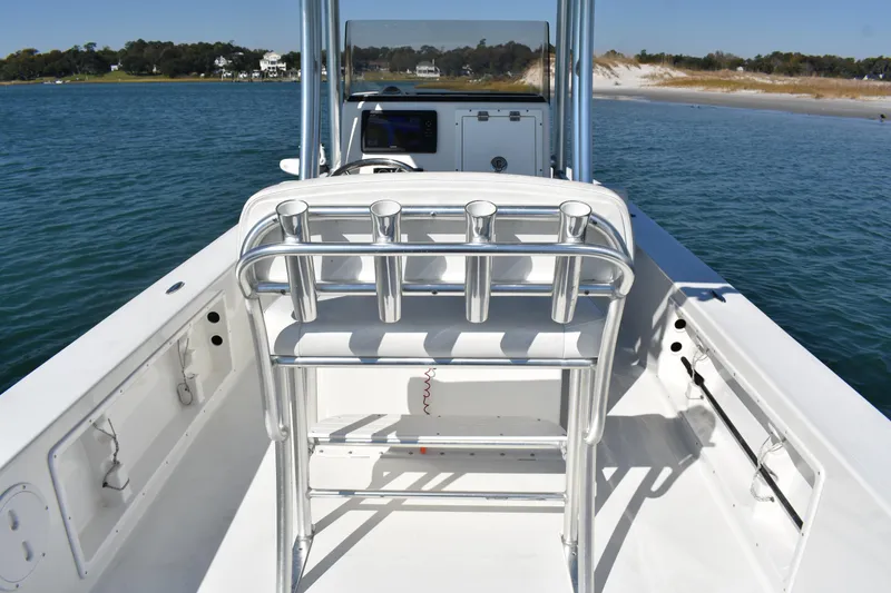 Slide: The Image of 2017 Bay Rider 2260 FS Skiff on water, featuring sleek design and spacious deck. - 11