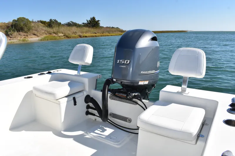 Slide: The Image of 2017 Bay Rider 2260 FS Skiff with Yamaha 150 engine on calm water. - 14
