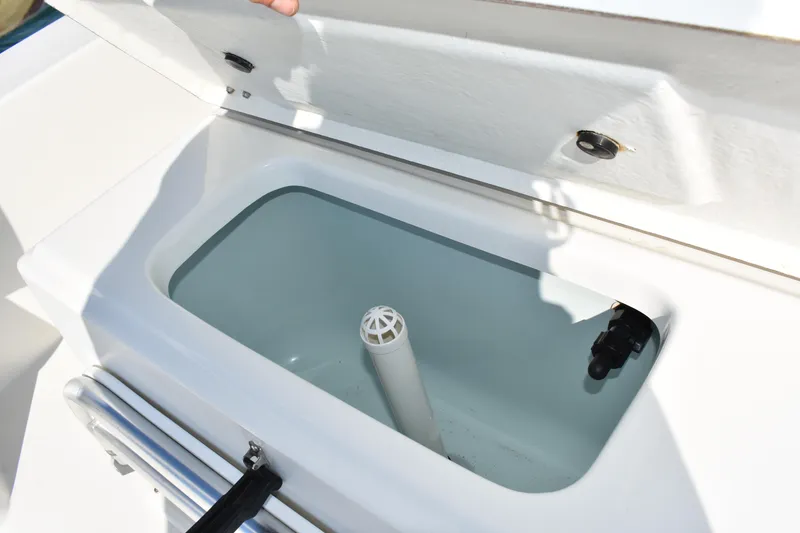 Slide: The Image of Open storage compartment on 2017 Bay Rider 2260 FS Skiff boat. - 15