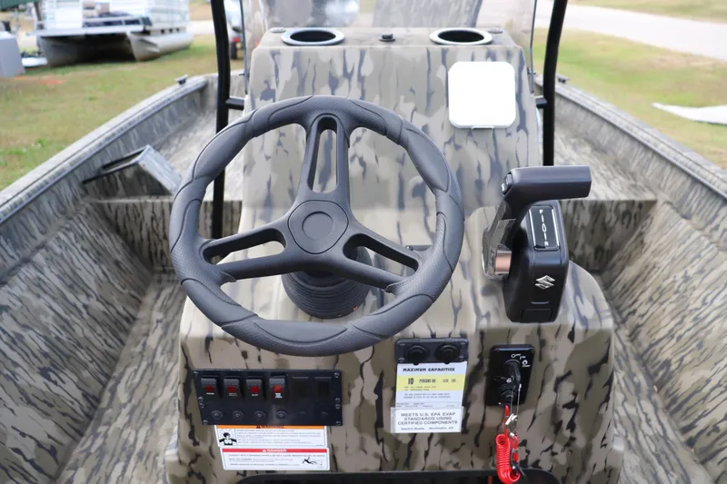 Slide: The Image of 2026 SeaArk Phantom 20XV CC boat console with steering wheel and controls, camo design. - 4