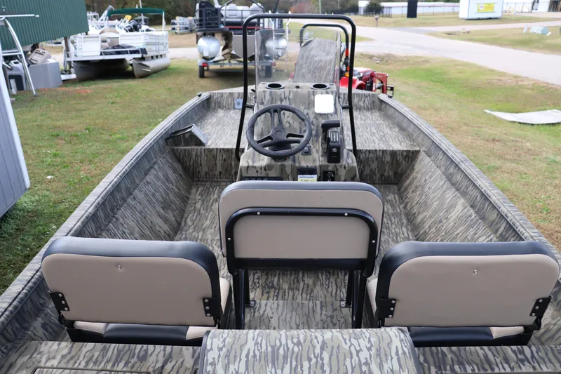 Slide: The Image of 2026 Sea Ark Phantom 20XV CC boat interior with camouflage design and seating. - 7