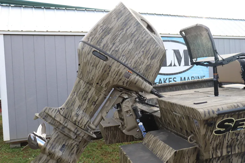 Slide: The Image of 2026 SeaArk Phantom 20XV CC boat with camo design and powerful outboard motor. - 9