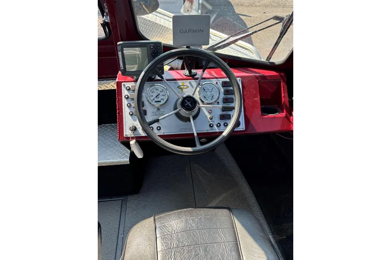 Slide: The Image of Cockpit of 2005 THINDERJET 21 ALEXIS boat with steering wheel and navigation instruments. - 6