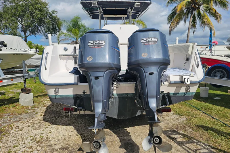 Slide: The Image of 2003 Grady-White Bimini 306 boat with twin 225 horsepower outboard engines. - 10