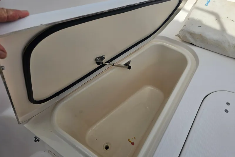 Slide: The Image of Open storage compartment on 2003 Grady-White Bimini 306 boat. - 15