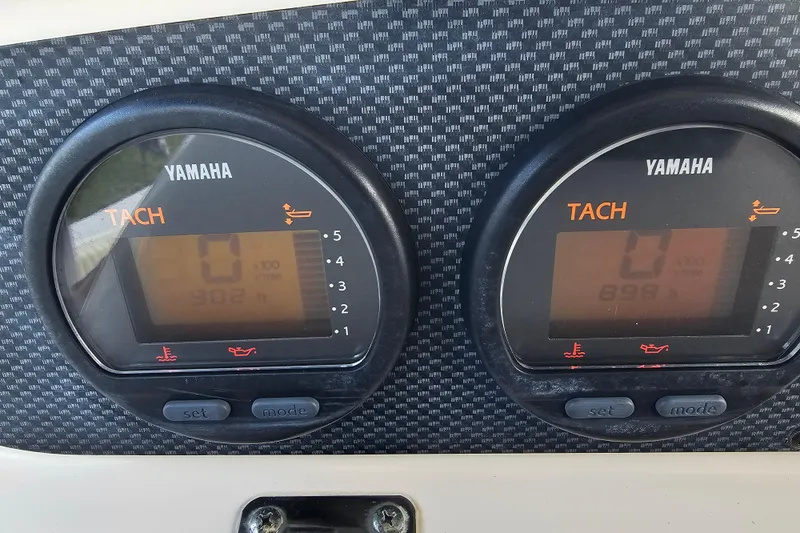 Slide: The Image of Yamaha tachometers on 2003 Grady-White Bimini 306 boat dashboard. - 27